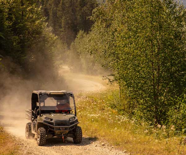 UTV riding a dirt trail